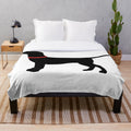 Soft plush blanket featuring a black labrador retriever with a red collar