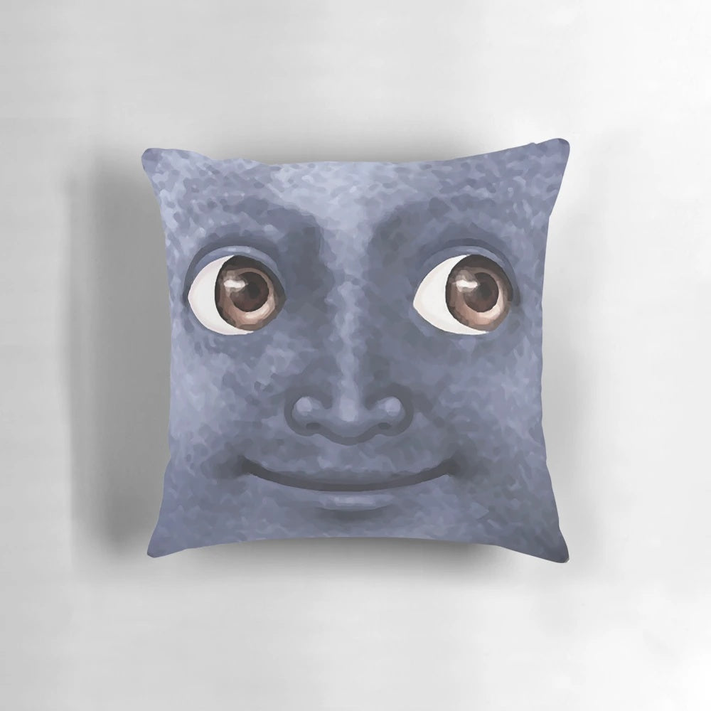 Black moon emoji printed on a decorative throw pillow