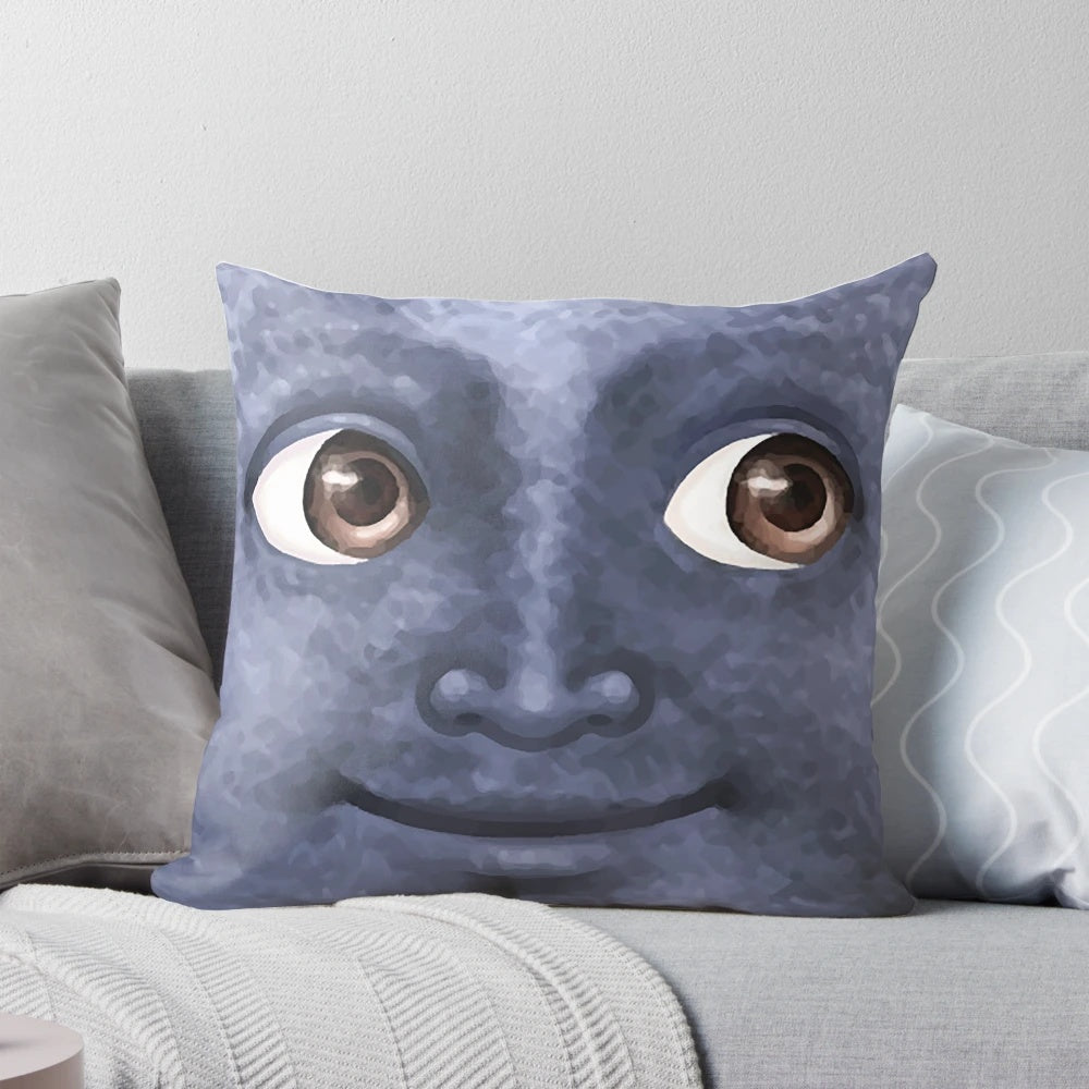 Black moon emoji printed on a decorative throw pillow