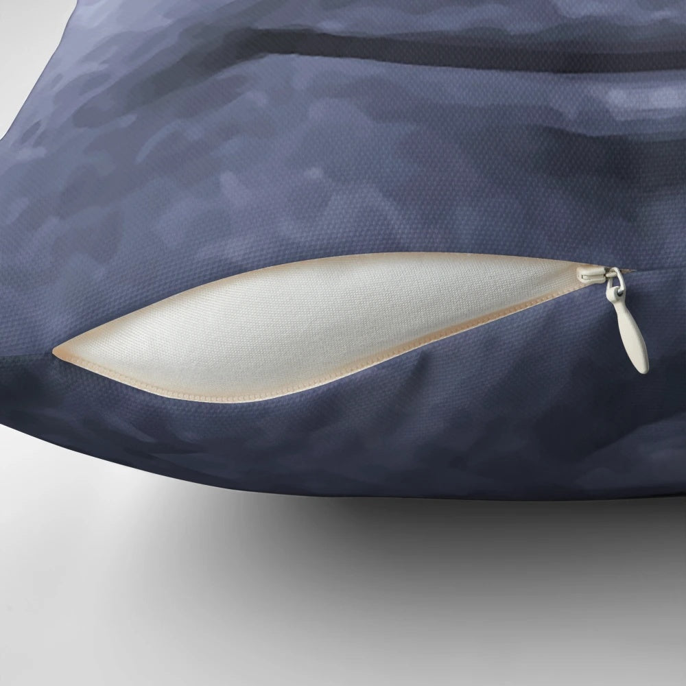 Black moon emoji printed on a decorative throw pillow