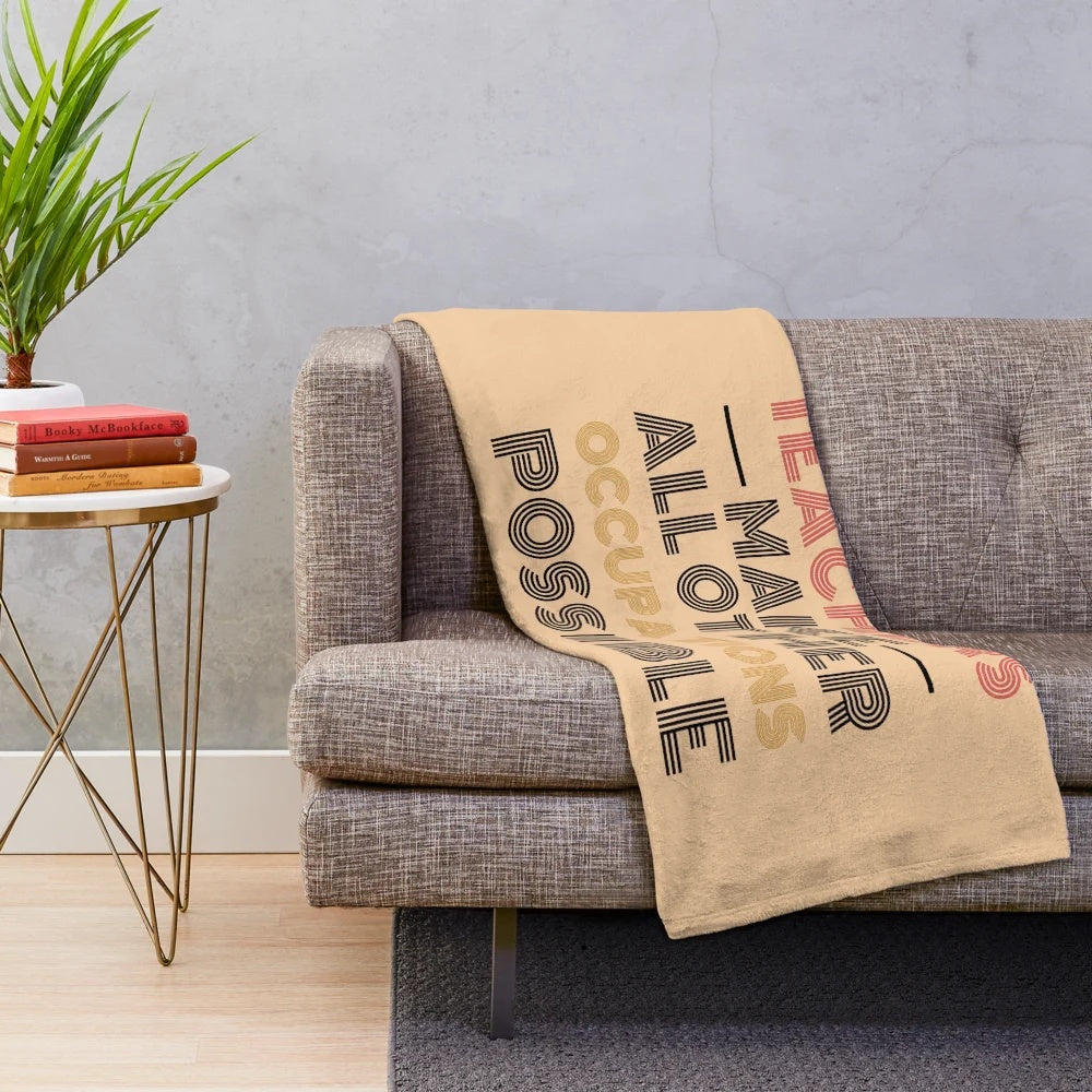 Black plush blanket with text "Teachers Make All Other Occupations Possible