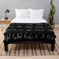 Cozy black plush blanket with a pastel pattern design