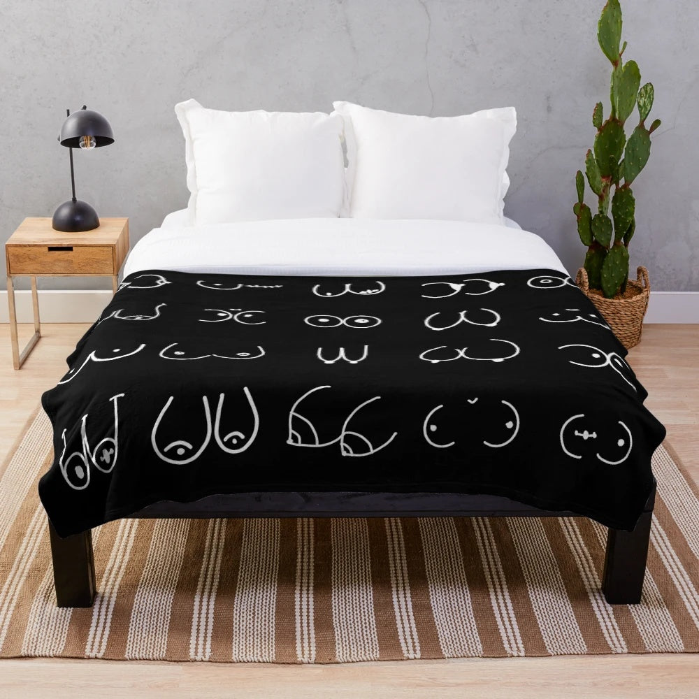 Cozy black plush blanket with a pastel pattern design