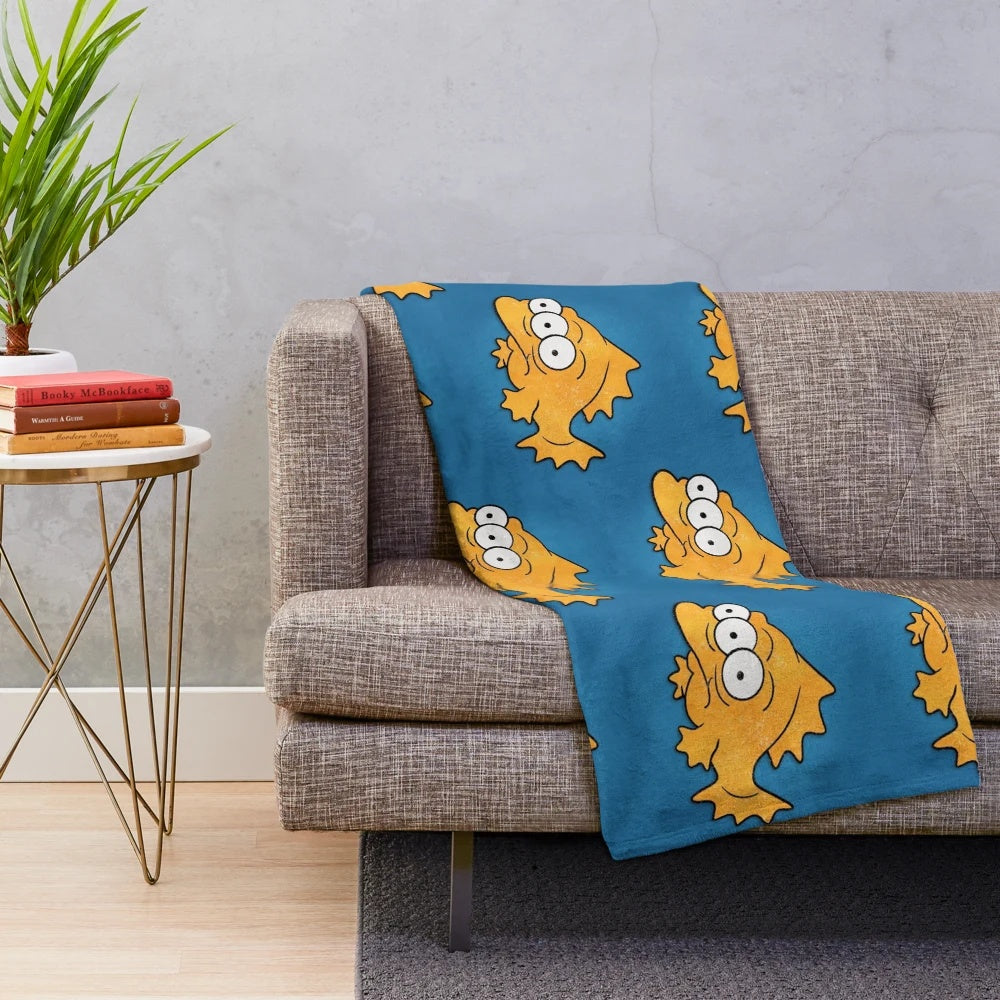 Blinky the three-eyed fish from The Simpsons on a cozy plush blanket