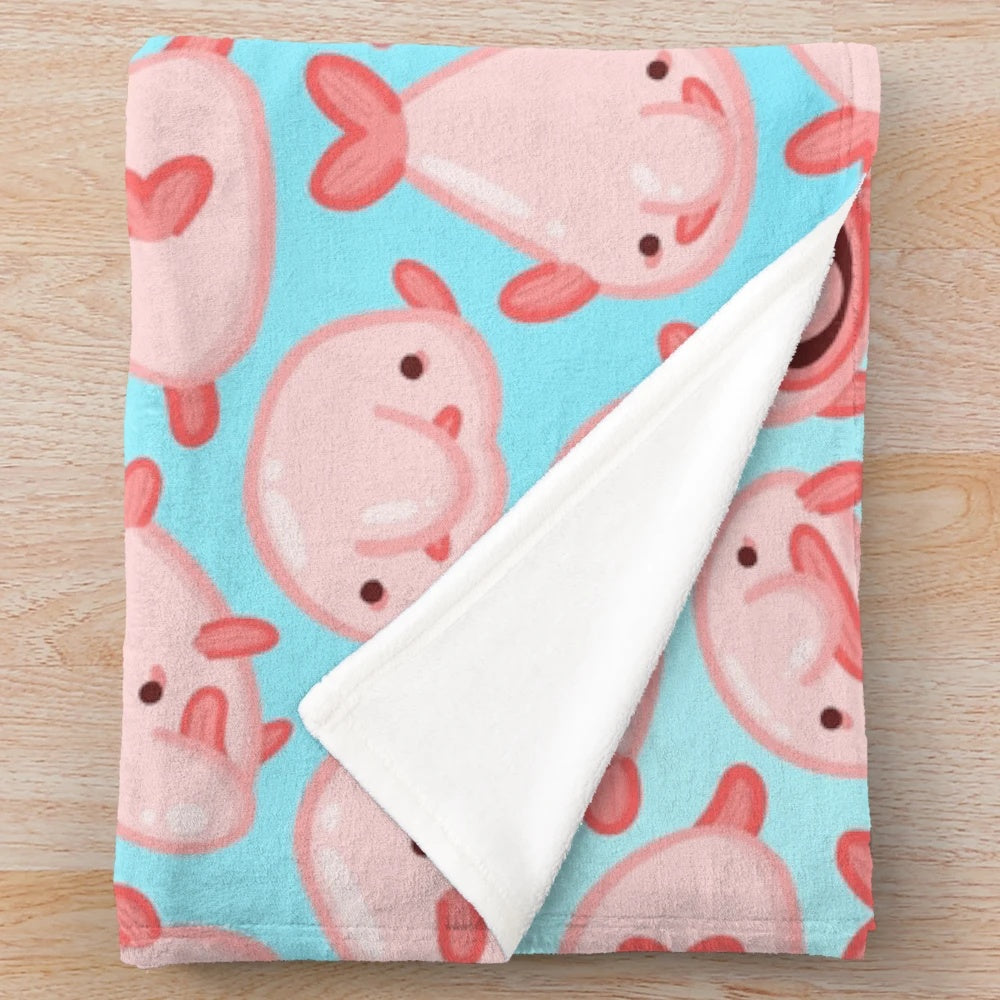 Soft and cuddly plush blanket featuring a cute blobfish pattern design