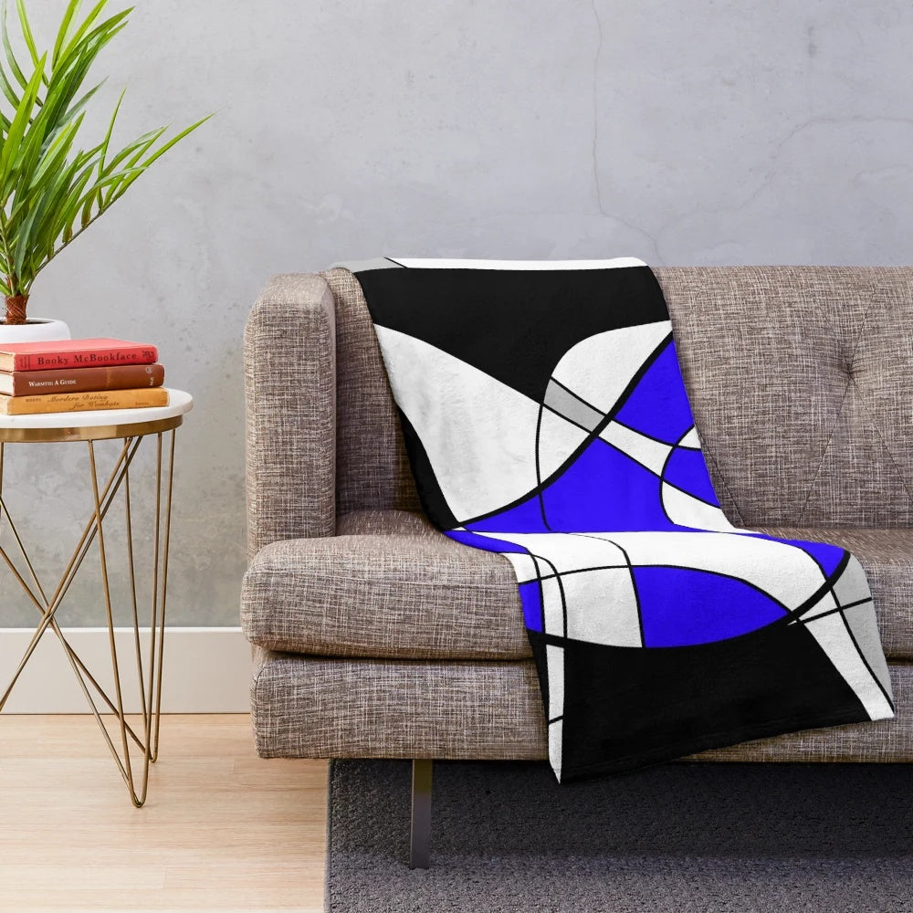Blue abstract motion plush blanket with geometric patterns and contemporary design
