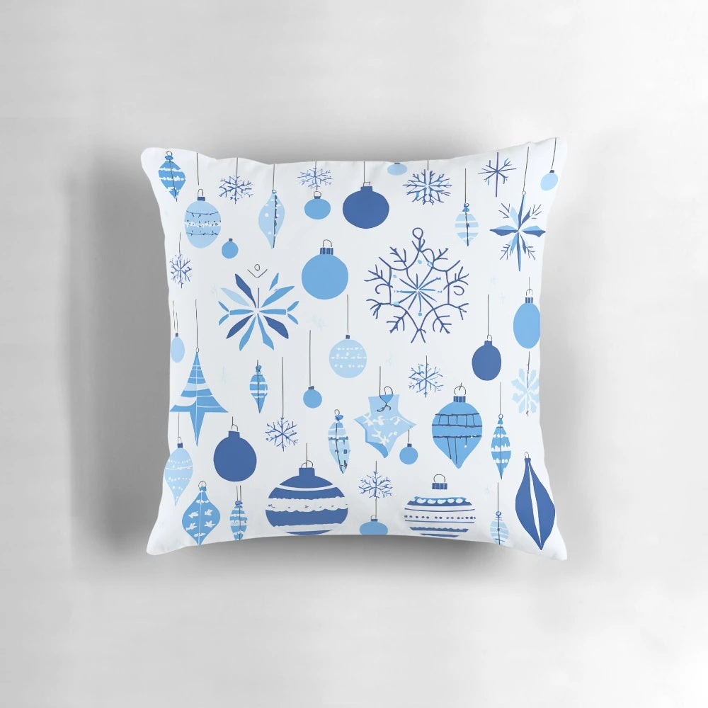 A blue and white patterned Christmas pillow with a festive design, perfect for winter home decoration.
