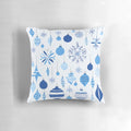 A blue and white patterned Christmas pillow with a festive design, perfect for winter home decoration.