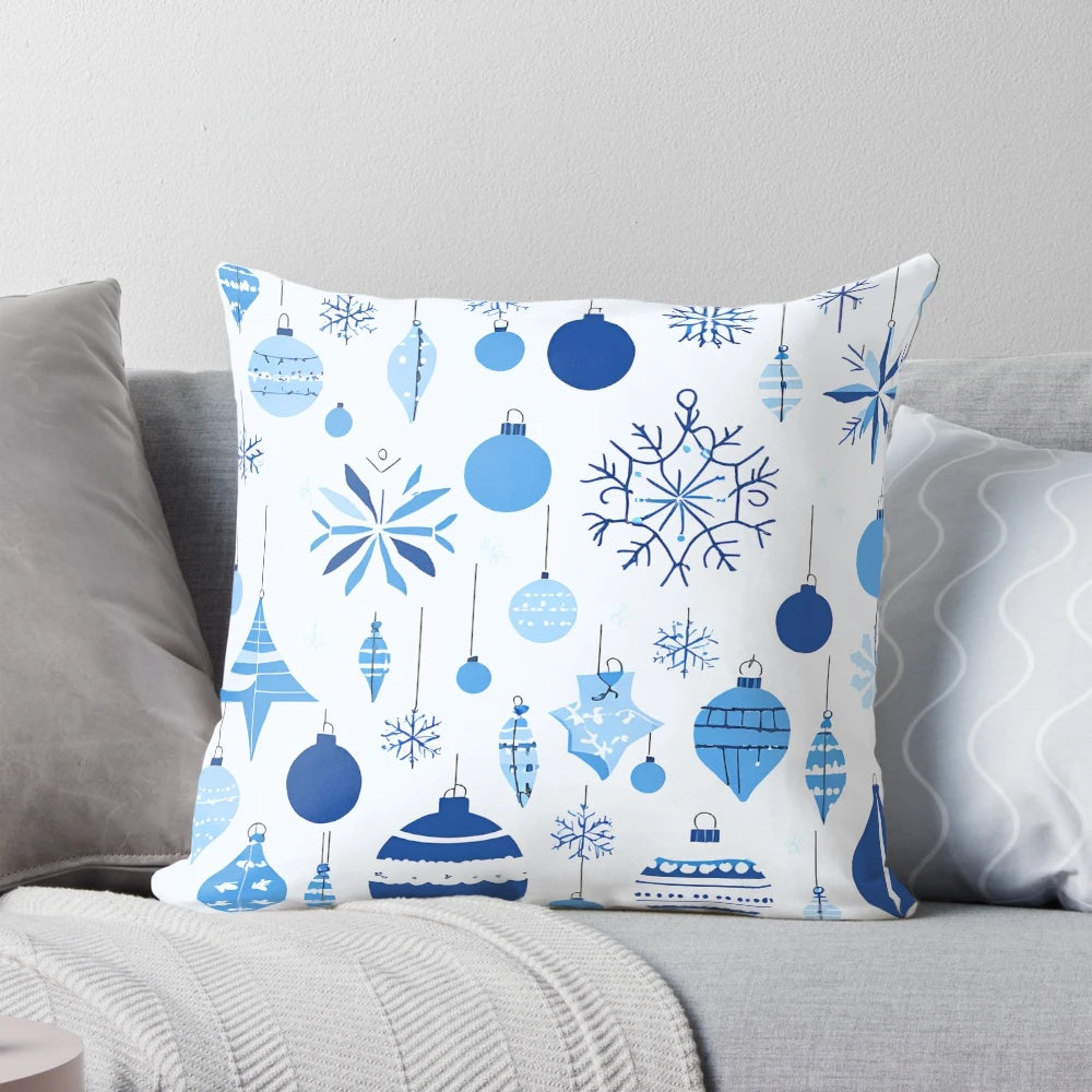 A blue and white patterned Christmas pillow with a festive design, perfect for winter home decoration.