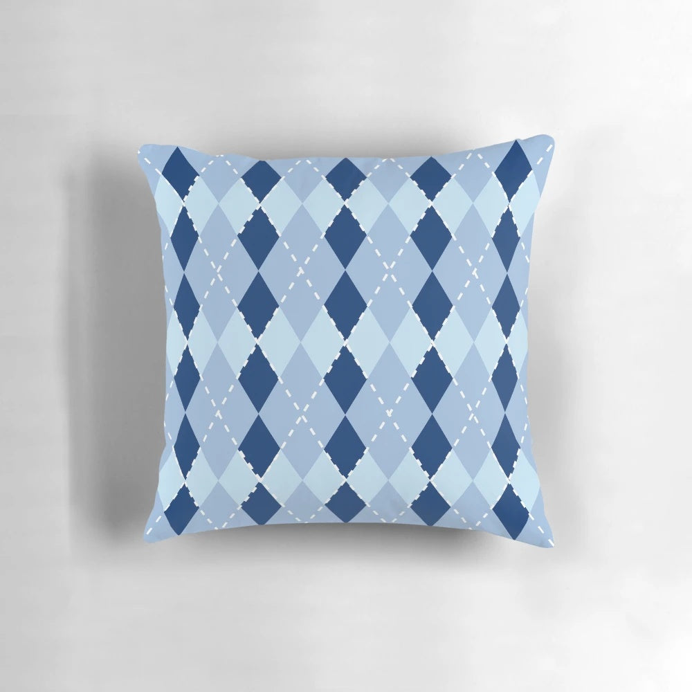 Blue argyle patterned pillow with a diamond design