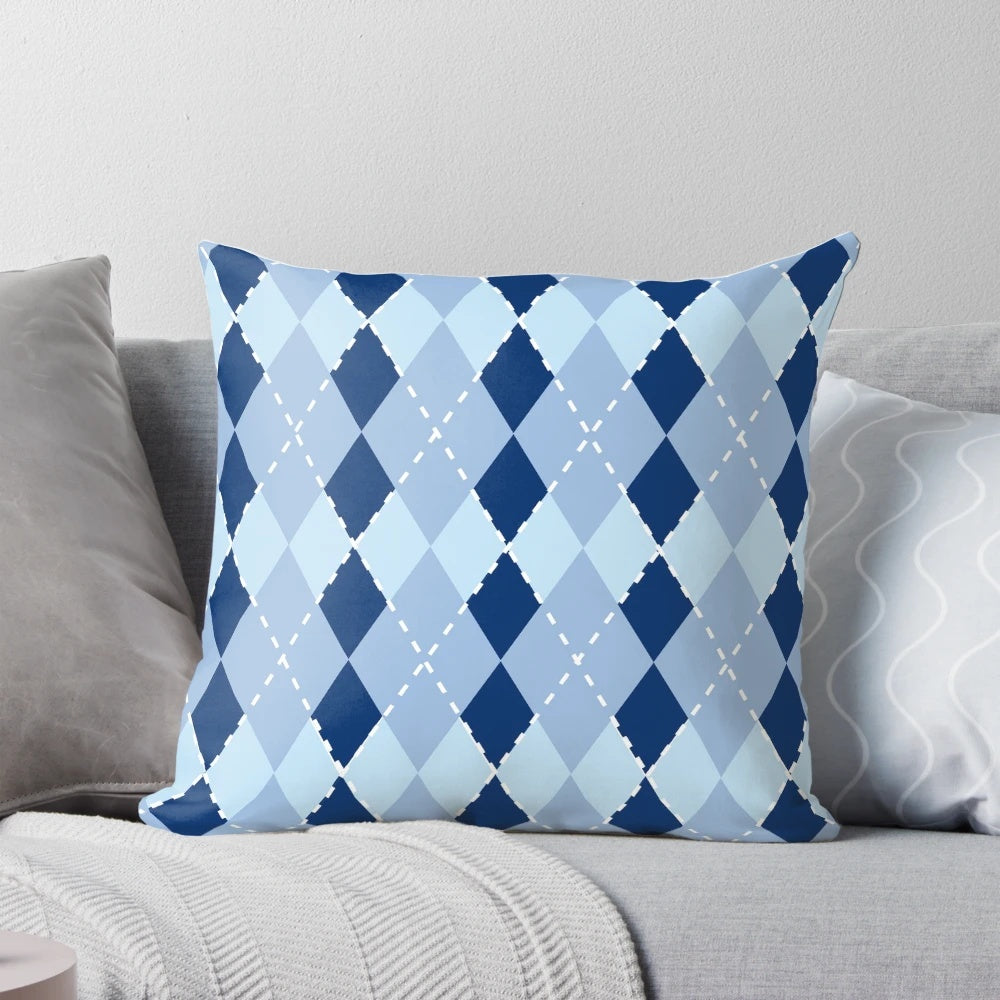 Blue argyle patterned pillow with a diamond design
