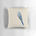 A soft, plush pillow featuring a cute blue budgie or parakeet design.