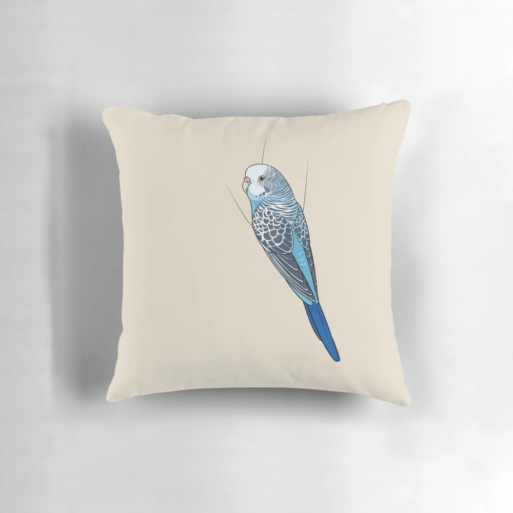 A soft, plush pillow featuring a cute blue budgie or parakeet design.