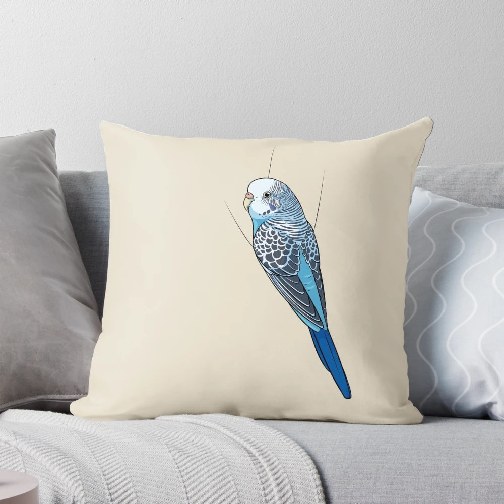 A soft, plush pillow featuring a cute blue budgie or parakeet design.