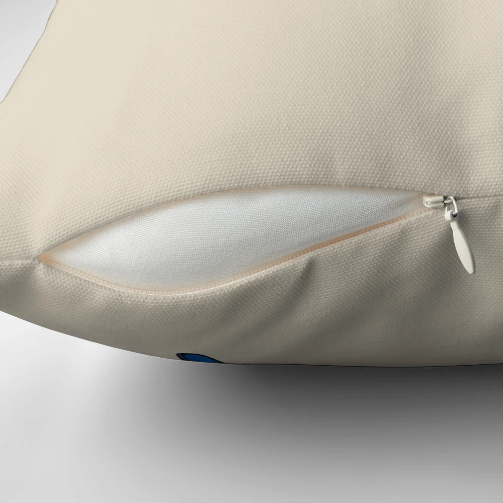 A soft, plush pillow featuring a cute blue budgie or parakeet design.