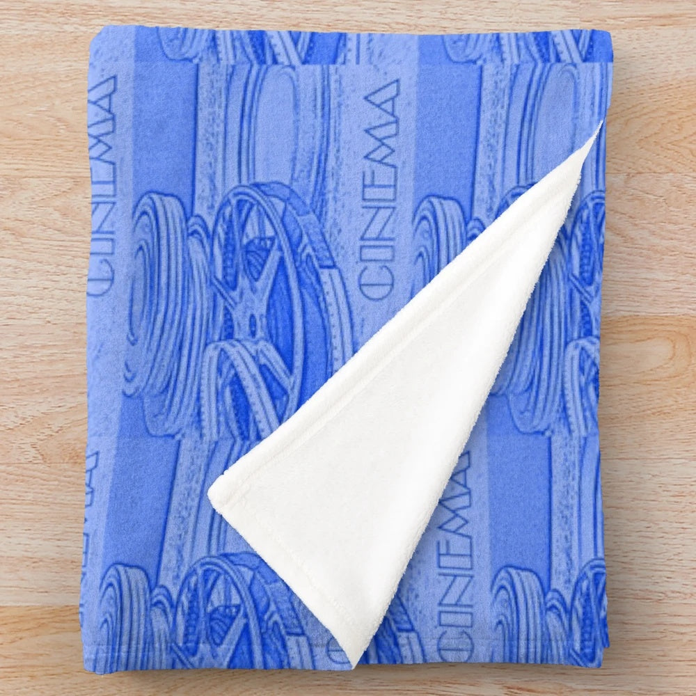 Blue plush blanket with a repeating cinema film reel pattern