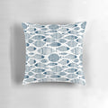 Blue and white fish-patterned pillow, perfect for ocean-inspired Scandinavian home decor.