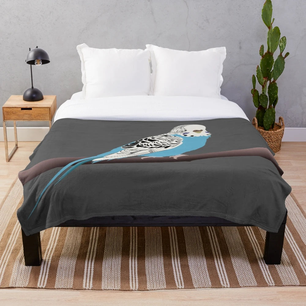 Blue parakeet plush blanket with a bird design