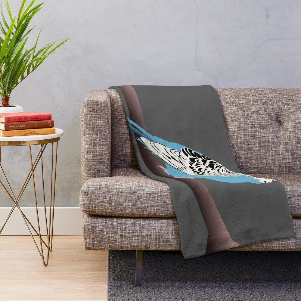 Blue parakeet plush blanket with a bird design