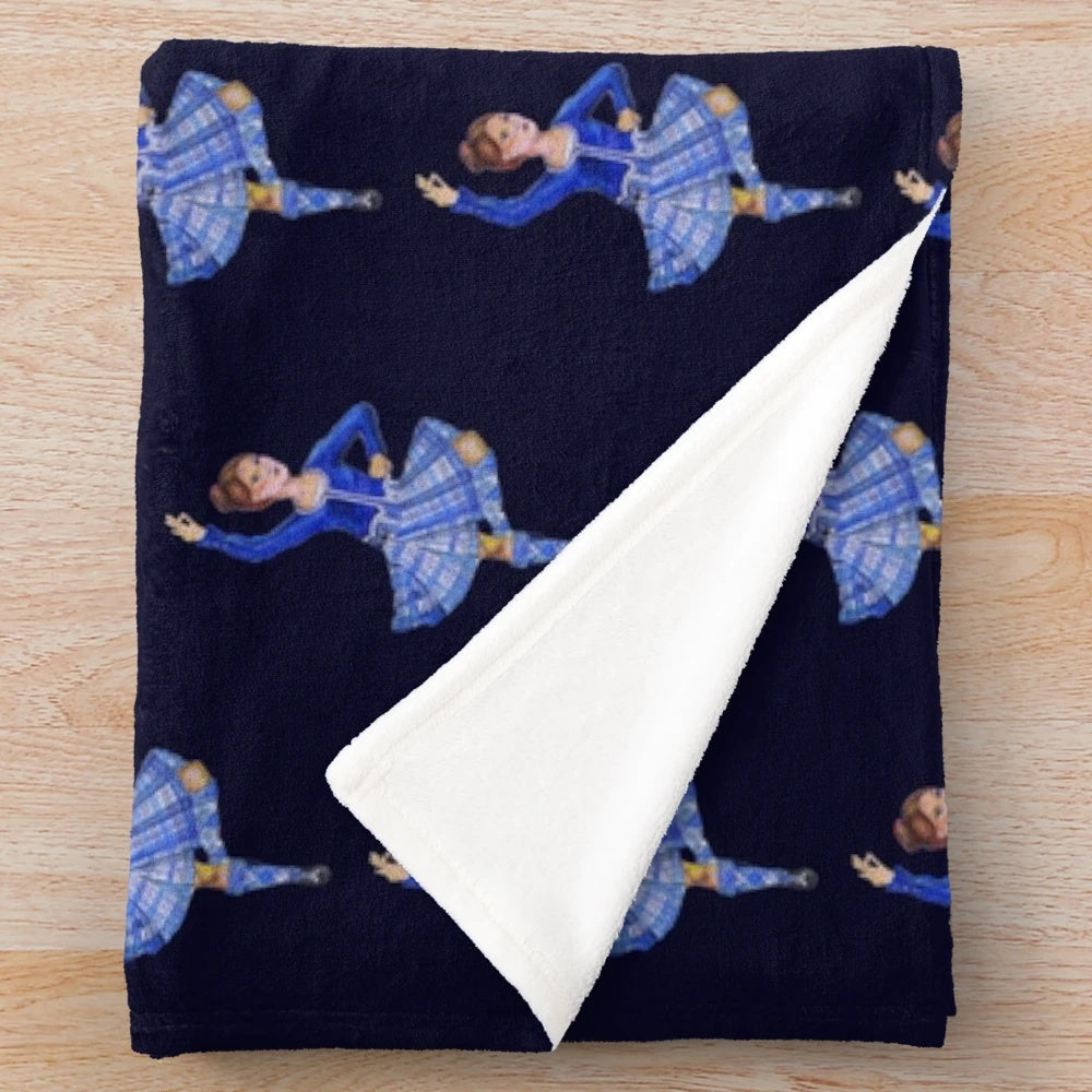 A blue plush blanket with an image of a highland dancer in traditional Scottish attire