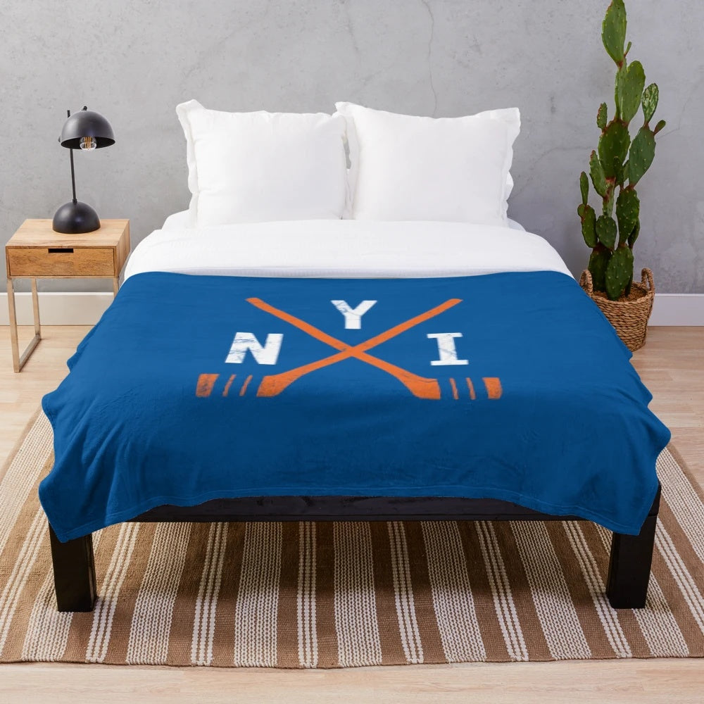 Blue plush blanket with New York Islanders hockey team logo