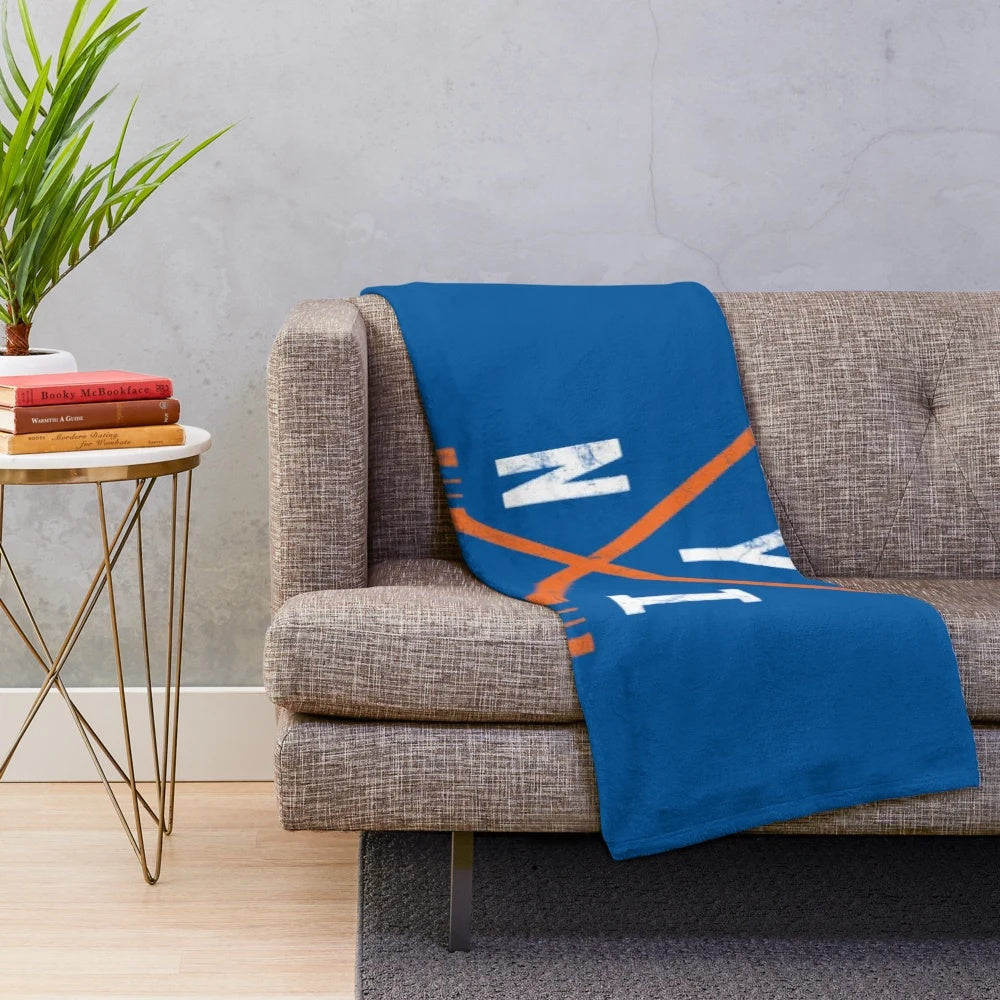 Blue plush blanket with New York Islanders hockey team logo