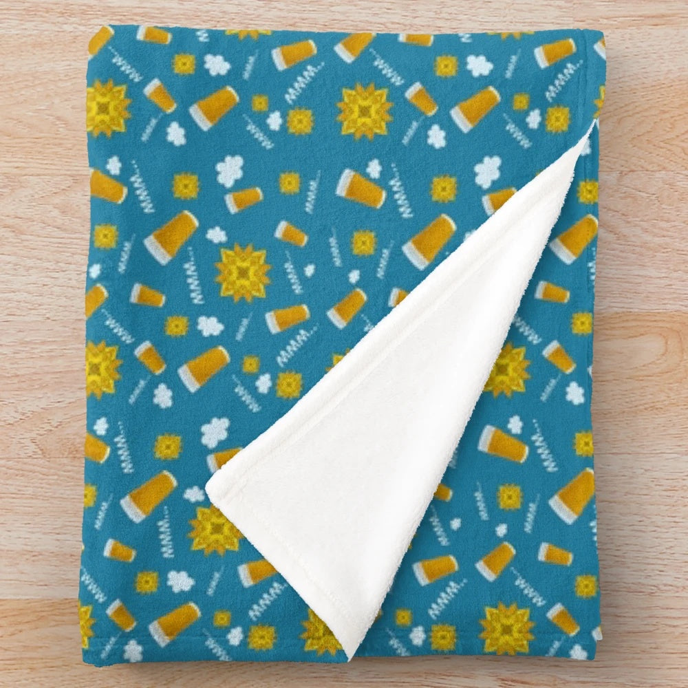 A blue plush blanket perfect for enjoying a summer beer