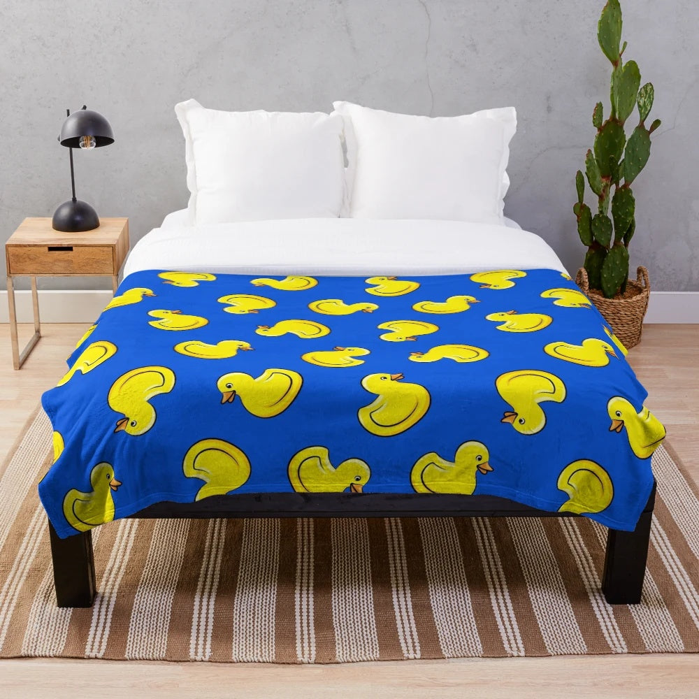 Blue plush blanket with rubber duck designs