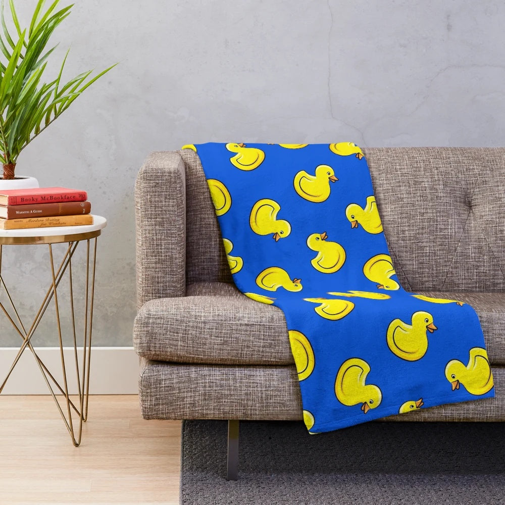 Blue plush blanket with rubber duck designs