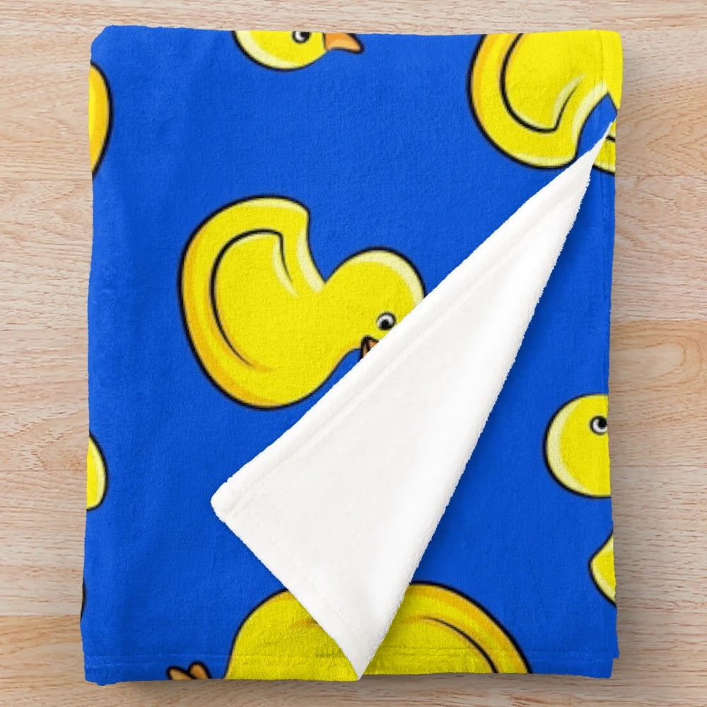 Blue plush blanket with rubber duck designs