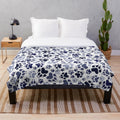 Blue plush dog blanket with paw print design