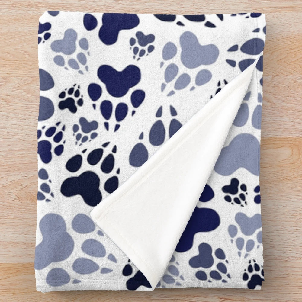 Blue plush dog blanket with paw print design