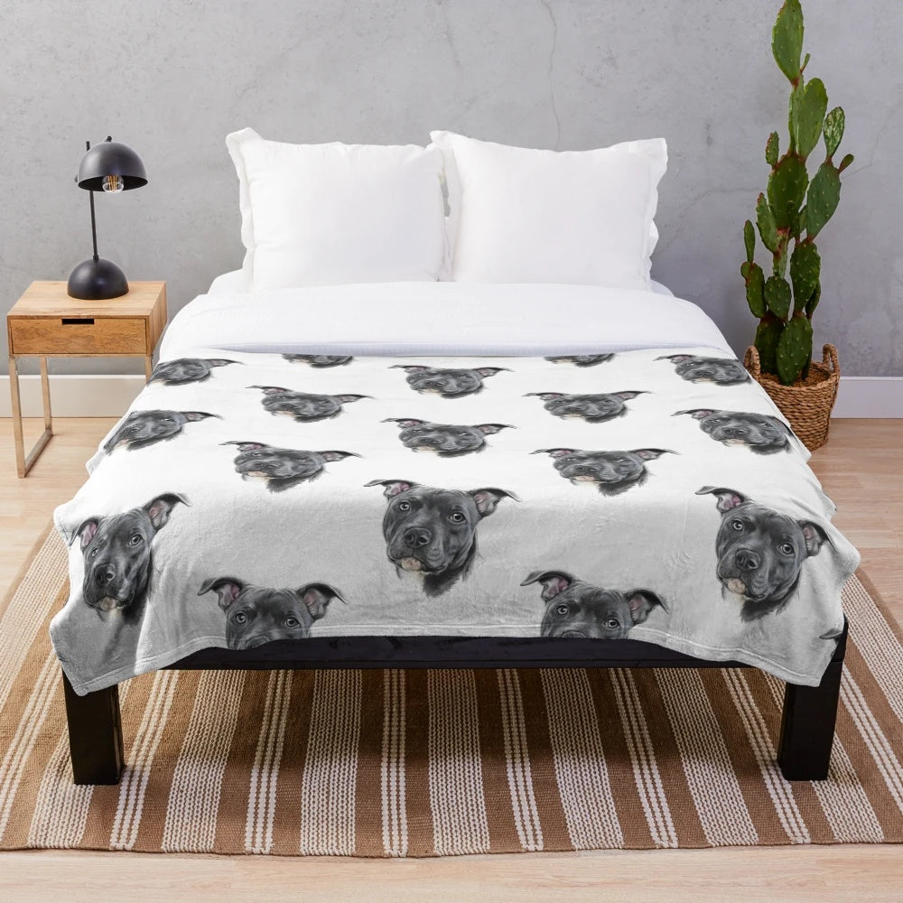 A soft and plush blue staffy dog blanket