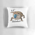 A decorative throw pillow featuring a playful blue tongue skink design, perfect for adding a touch of nature-inspired style to your home.
