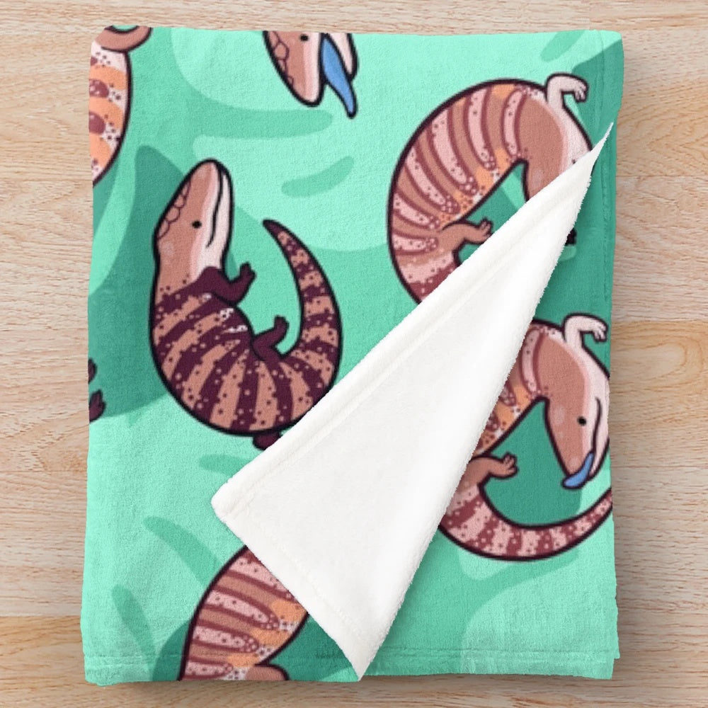 Cozy blue tongue skink plush blanket with a cute, cartoon-like design