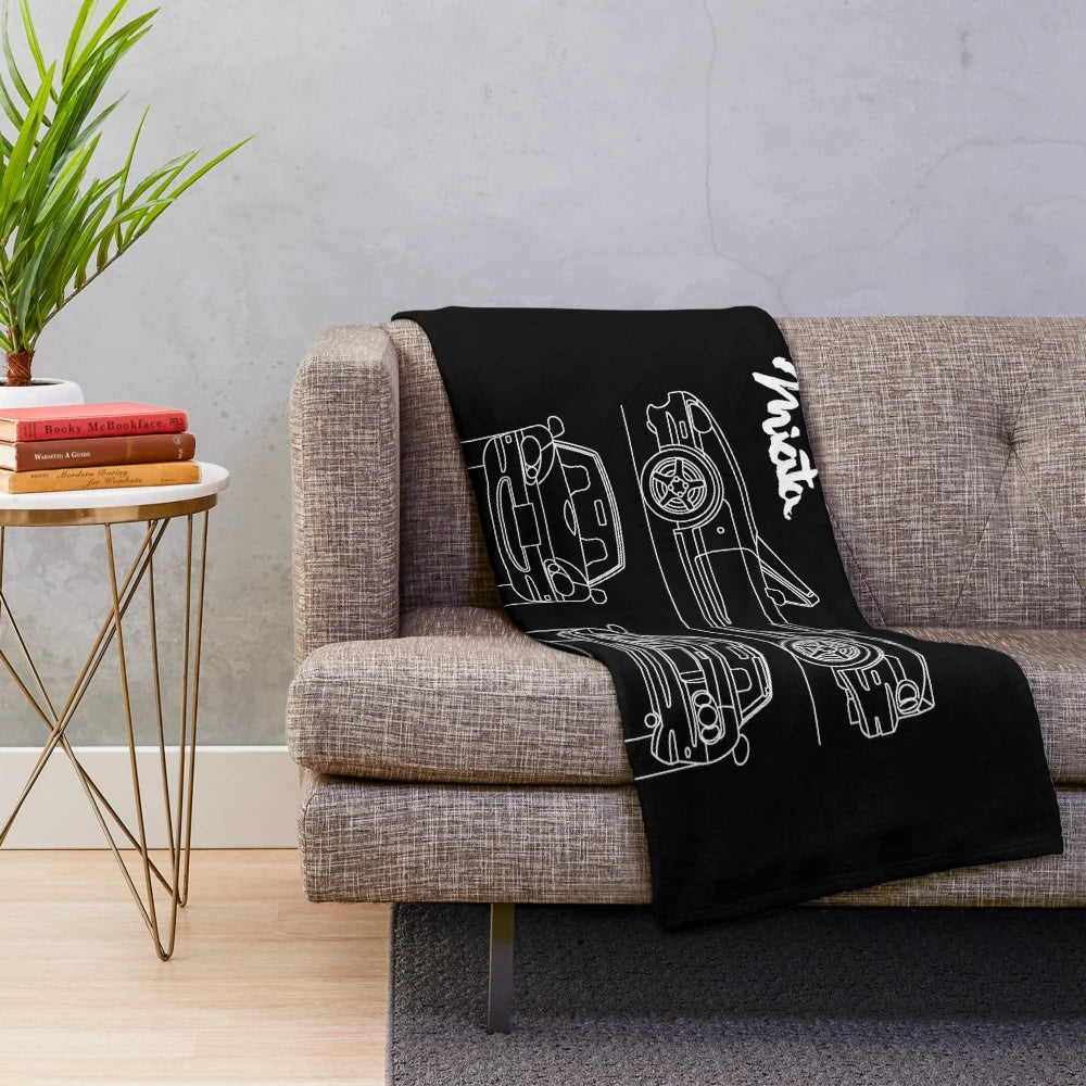 Plush blanket featuring blueprint-inspired design of the Mazda MX-5 Miata sports car