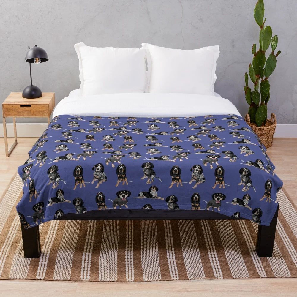 Bluetick coonhound on a soft, blue plush blanket