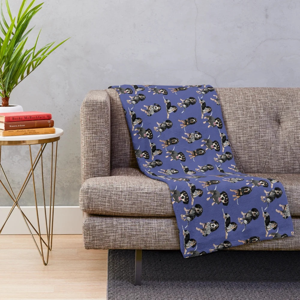 Bluetick coonhound on a soft, blue plush blanket