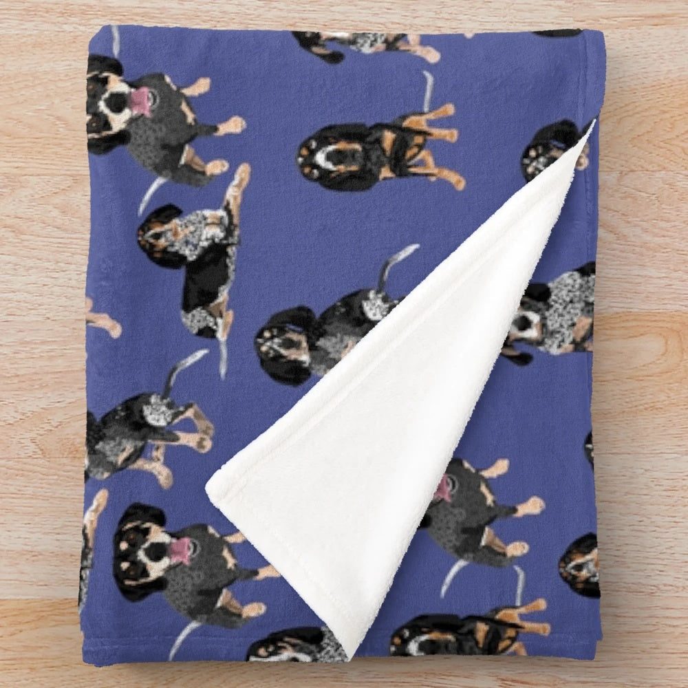 Bluetick coonhound on a soft, blue plush blanket
