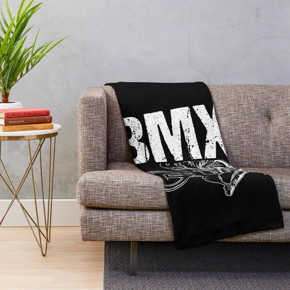 Plush blanket featuring a BMX-inspired design for cycling enthusiasts