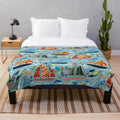 Plush blanket featuring a cute boats and ships pattern for a nautical-inspired nursery