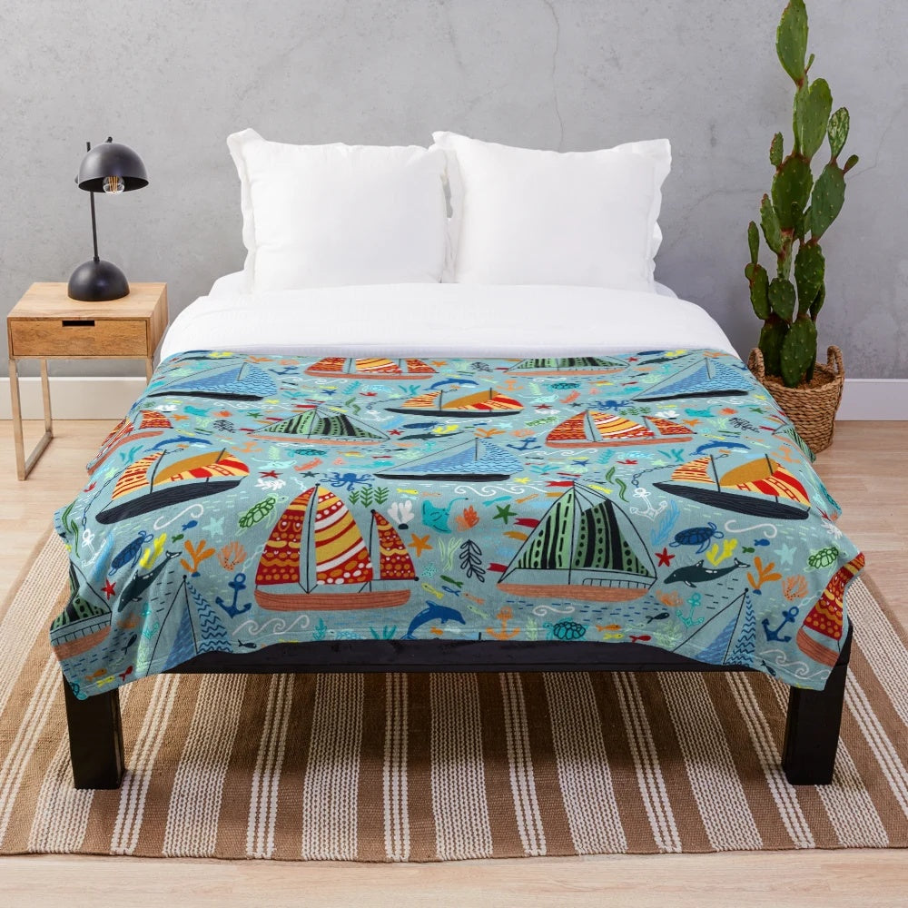 Plush blanket featuring a cute boats and ships pattern for a nautical-inspired nursery