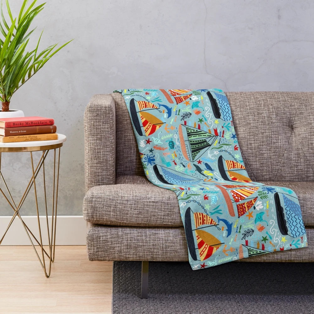 Plush blanket featuring a cute boats and ships pattern for a nautical-inspired nursery