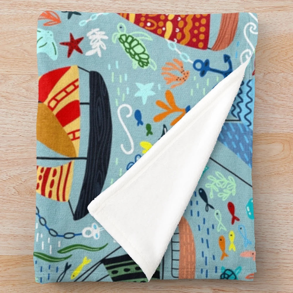 Plush blanket featuring a cute boats and ships pattern for a nautical-inspired nursery