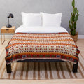 Bohemian-inspired plush blanket in Moroccan-style pattern