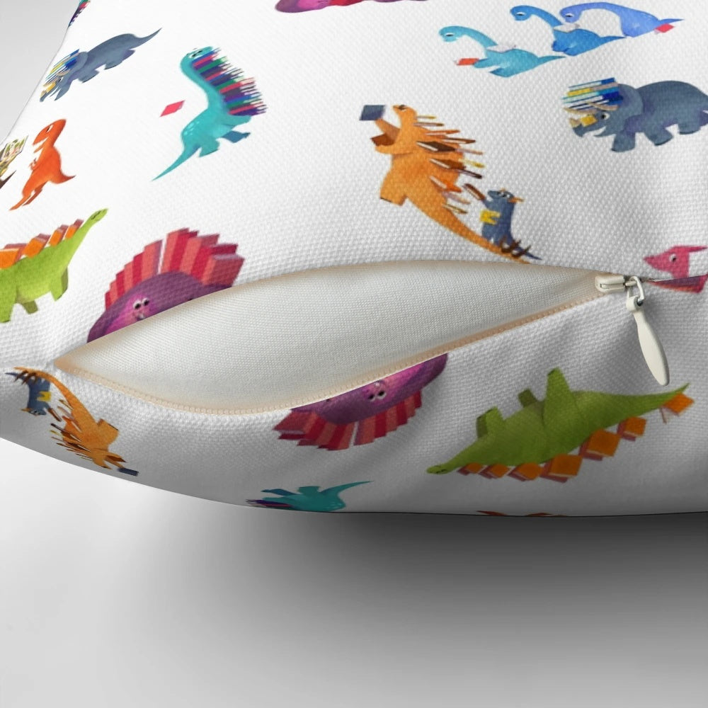 Soft, plush pillow featuring a vibrant dinosaur book design, perfect for kids' rooms and home decor.