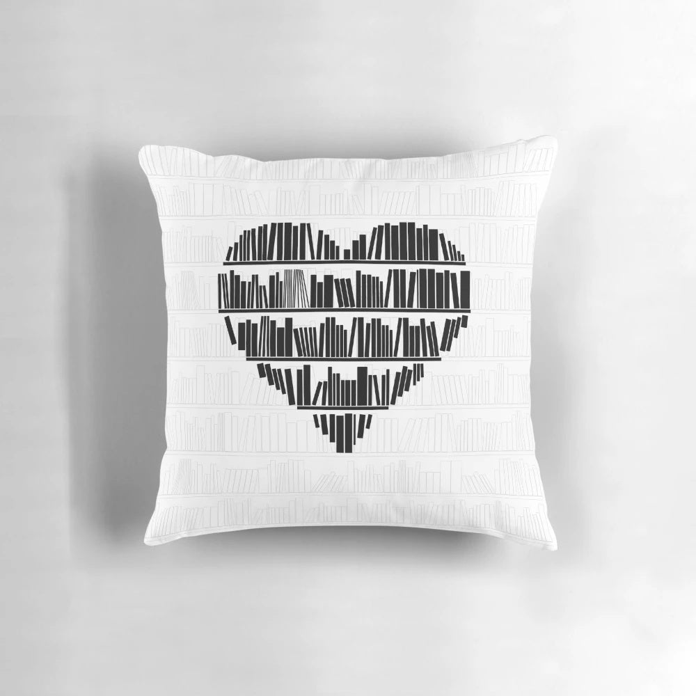 A cozy plush pillow with a heart-shaped book design for book lovers and reading enthusiasts.