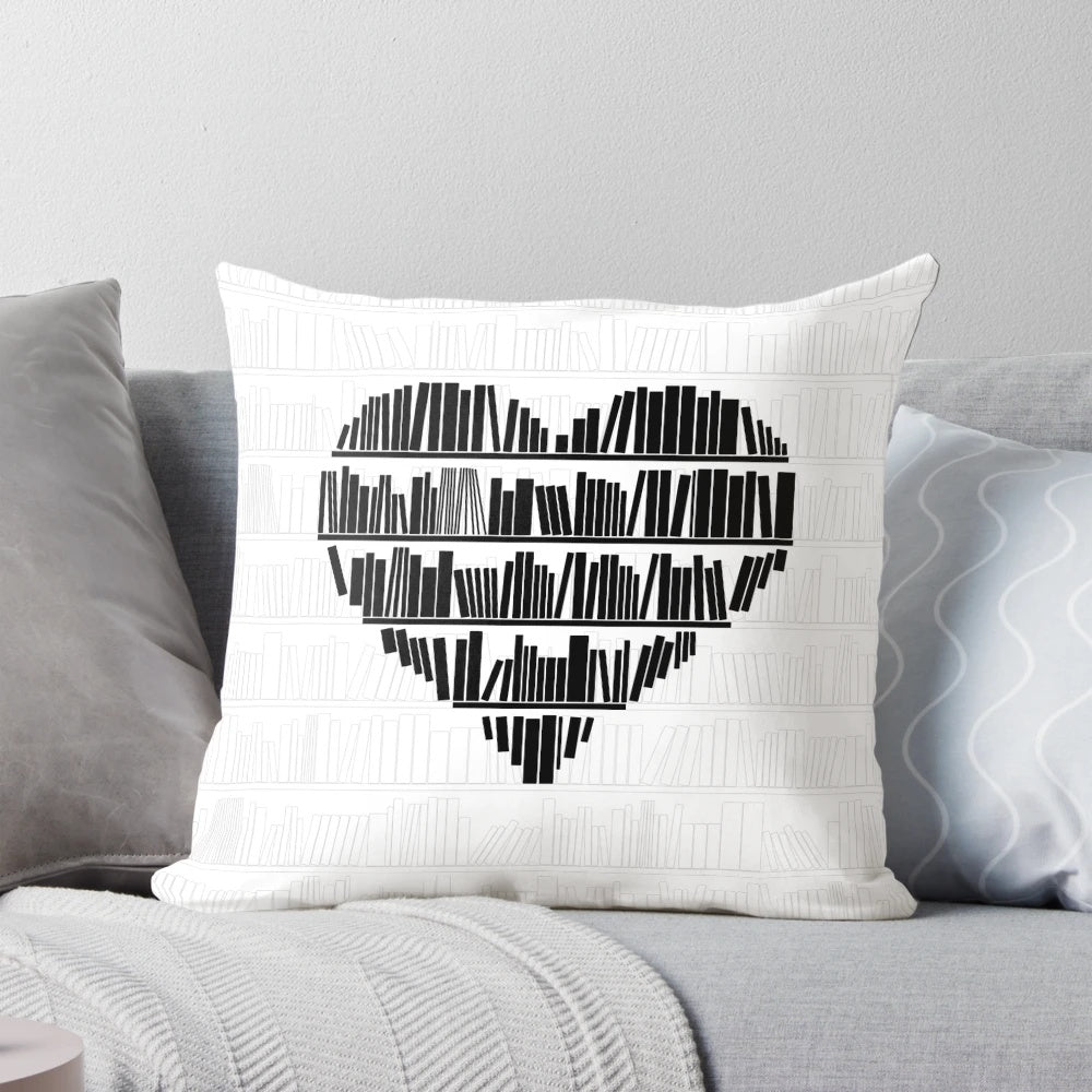A cozy plush pillow with a heart-shaped book design for book lovers and reading enthusiasts.