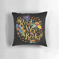 Decorative black pillow with floral gold foil design, perfect for book lovers