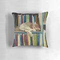 "A soft, fluffy pillow with a cute kitten illustration and books, perfect for book lovers and reading enthusiasts."